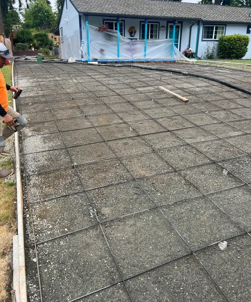 Broom finish driveway and decorate borders in Federal Way 